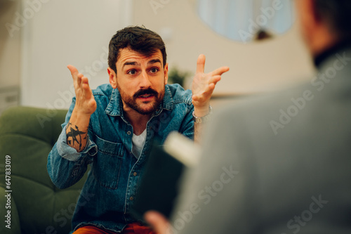 Photography An angry client is expressing his feelings and explaining problems with a shrink
