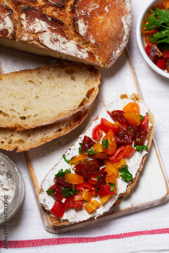 Obraz na płótnie Bruschetta from homemade bread with cottage cheese and sprat pate and tomatoes on a wooden background. Rustic style. w salonie