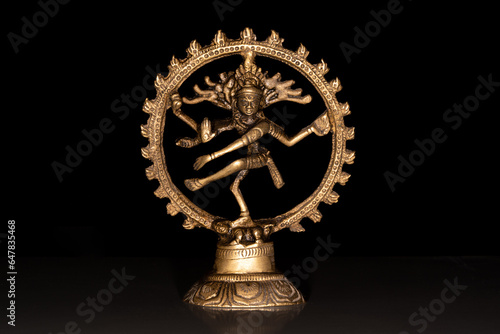 Statue of indian hindu god dancing Shiva Nataraja. isolated on black background
