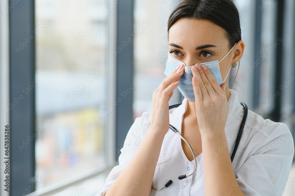 portrait of female doctor wearing protective mask. portrait of female doctor wearing protective mask.