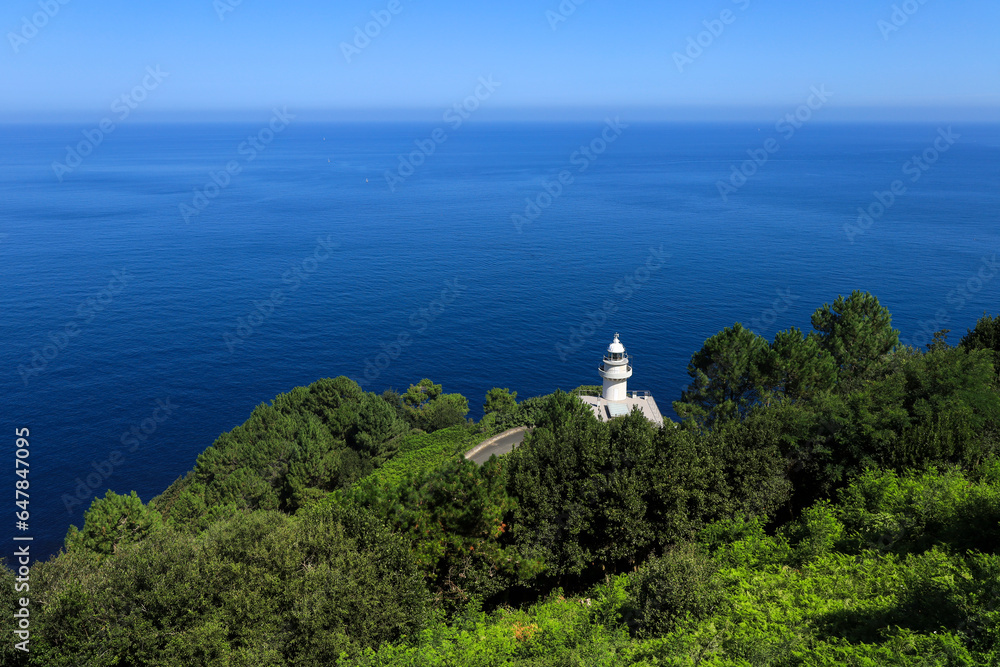 The Monte Igueldo lighthouse surrounded by vegetation