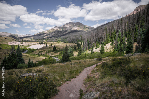 Bike trail overlooking Pole Creek and beautiful mountain range near towns of Creede and Lake City Colorado  photo