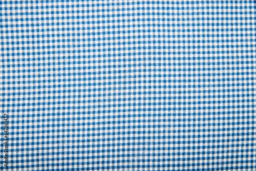 Fabric.Checkered fabric. Checkered pattern. Material for clothing. The texture of the binding gingham fabric. textile background. Fabric plaid. Close-up