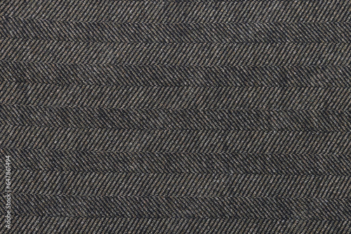 Classic tweed, Wool Background Texture. Coat close-up. Brown woolen fabric striped zigzag. Herringbone tweed, Wool Background Texture. Coat close-up. Expensive suit fabric.