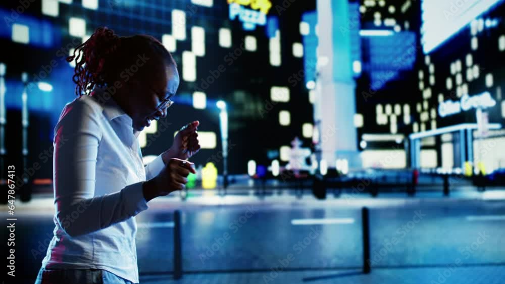 African american businesswoman prancing around in empty city streets during nighttime, feeling happy after receiving promotion at work. Jubilant woman enjoying herself while wandering on boulevard African american businesswoman prancing around in empty city streets during nighttime, feeling happy after receiving promotion at work. Jubilant woman enjoying herself while wandering on boulevard