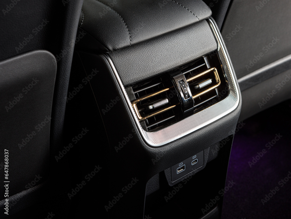 Obraz premium Close up car ventilation system and air conditioning for rears seats details and controls of modern car