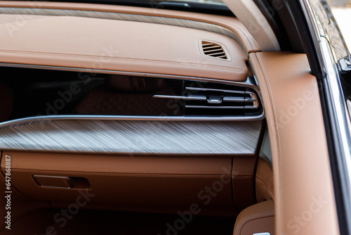 cool air condition in car, part of luxury vehicle in a light brown leather interior