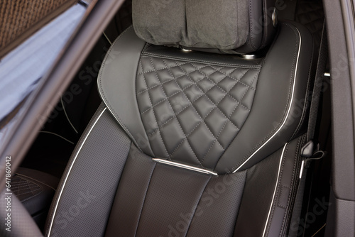Black elegant leather electric seat with massage in the interior of a luxury car © AvokadoStudio