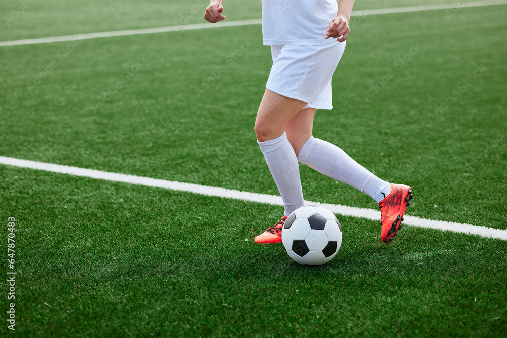 sports girl football player with a soccer ball on the soccer field, the concept of professional women's football