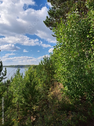 lake in the forest coast of siberian river autumn day landscape photo image