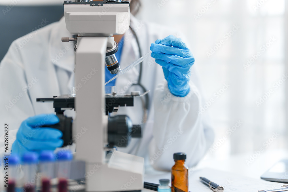 Young scientists pioneering medical discoveries in lab, with one scientist employing microscope for invaluable insights, blood lab test, virus vaccine invent, asian indian people Young scientists pioneering medical discoveries in lab, with one scientist employing microscope for invaluable insights, blood lab test, virus vaccine invent, asian indian people