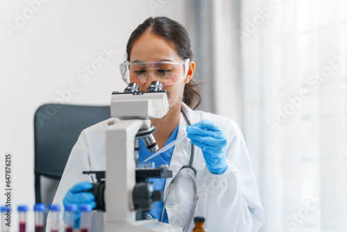 Young scientists pioneering medical discoveries in lab, with one scientist employing microscope for invaluable insights, blood lab test, virus vaccine invent, asian indian people