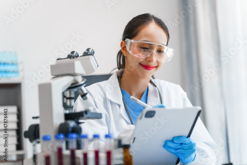 Young scientists pioneering medical discoveries in lab  with one scientist employing microscope for invaluable insights  blood lab test  virus vaccine invent  asian indian people