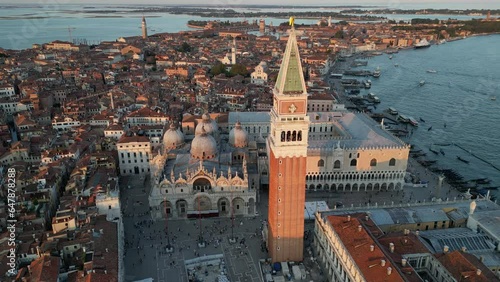 Establishing Aerial View Shot of Venice city skyline, St. Mark's Square with Doge's Palace, Basilica, and Campanile, Italy photo