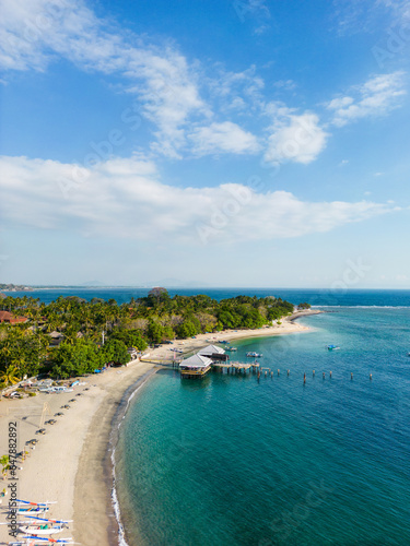 Fototapeta Naklejka Na Ścianę i Meble -  Senggigi beach aerial landscape by drone in Lombok, Indonesia. Popular beach area in Lombok, Indonesia