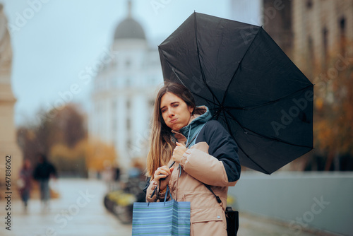 Obraz na plátně Stressed Woman Walking in the Rain with Broken Umbrella