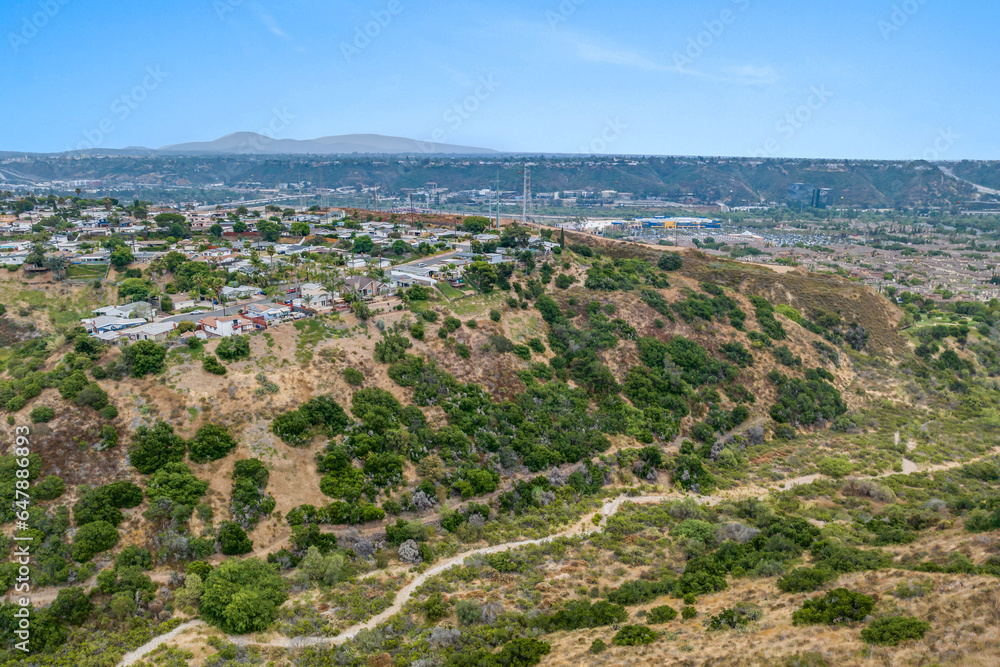 Aerial view of house in Serra Mesa City in San Diego, California, USA. Green Dry Valley and Villas