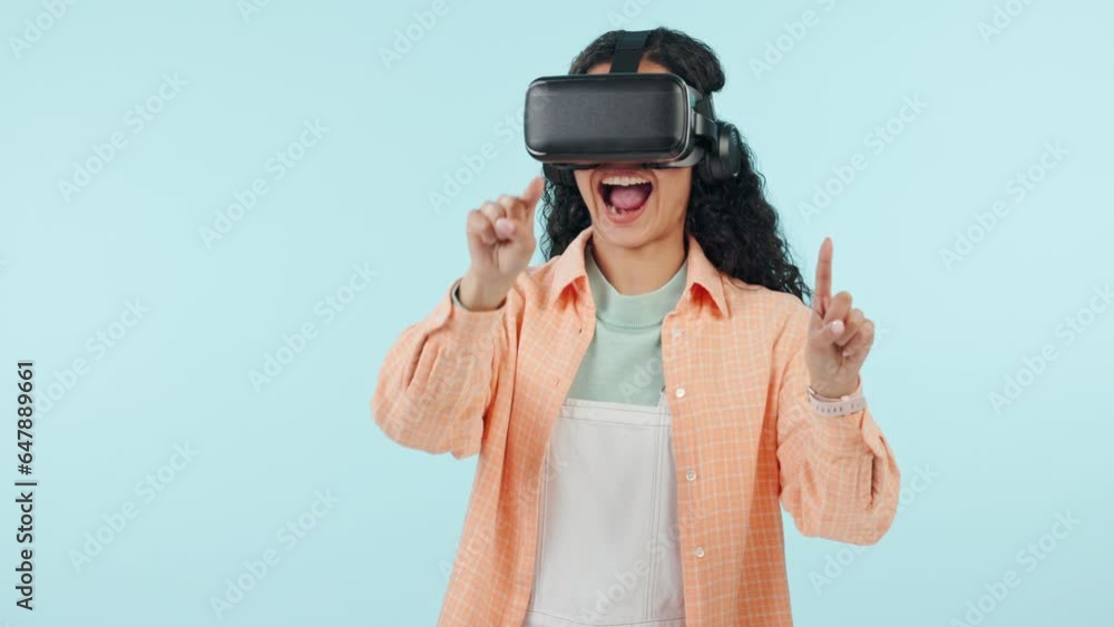 Woman, virtual reality and glasses for futuristic e learning, software or user experience on blue background. Wow, excited and student writing on screen, language education or VR technology in studio Woman, virtual reality and glasses for futuristic e learning, software or user experience on blue background. Wow, excited and student writing on screen, language education or VR technology in studio