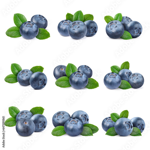 Set with fresh blueberries and green leaves isolated on white