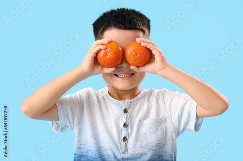 Little Asian boy with fresh...