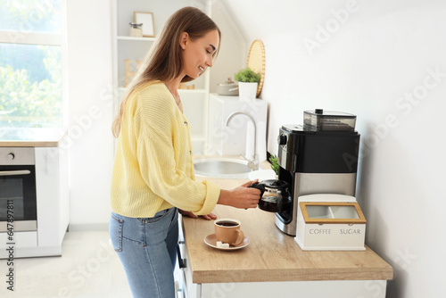 Beautiful young woman using...