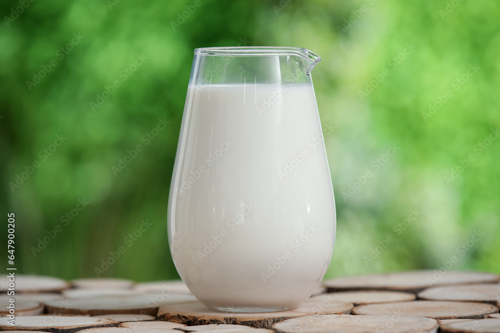 Jug of fresh milk on wooden table outdoors Jug of fresh milk on wooden table outdoors