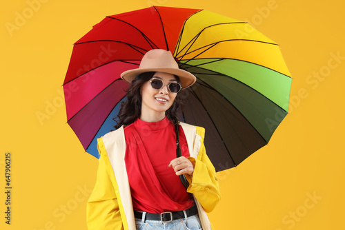 Smiling young woman in styl...