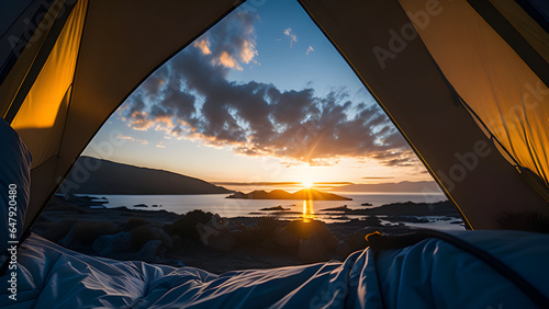 camping tent high in the mountains at sunset