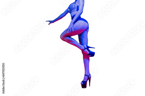 Skinny slim young sexy girl dancer in neon light posing on white isolated background