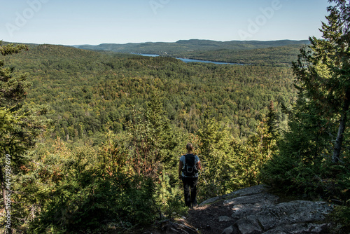Girl hiking in the Forest near lake in La Mauricie National Park Quebec, Canada on a beautiful day © CL-Medien