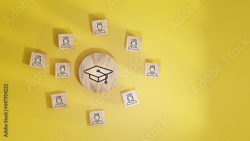 Male and female student icons on wooden blocks. Education concept for success.