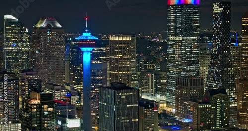 Calgary AB Canada Aerial v3 establishing night hyperlapse zoomed 3x capturing illuminated downtown cityscape with glowing and shimmering skyscrapers exteriors - Shot with Mavic 3 Pro Cine - July 2023 photo