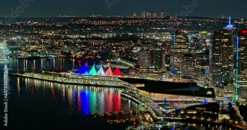 Vancouver BC Canada Aerial v3 hyperlpase panoramic view capturing shipyard, illuminated harbor, landmark Canada Place and waterfront downtown night cityscape - Shot with Mavic 3 Pro Cine - July 2023 photo