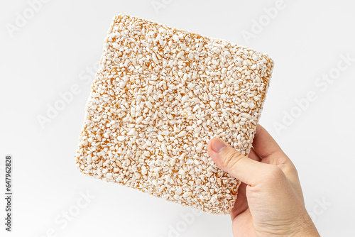 Traditional Korean snack made from glutinous rice and grain syrup on white background photo