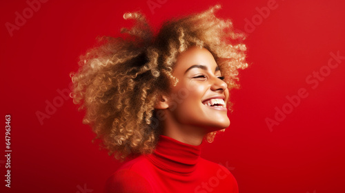 Happy young african american woman on a solid background