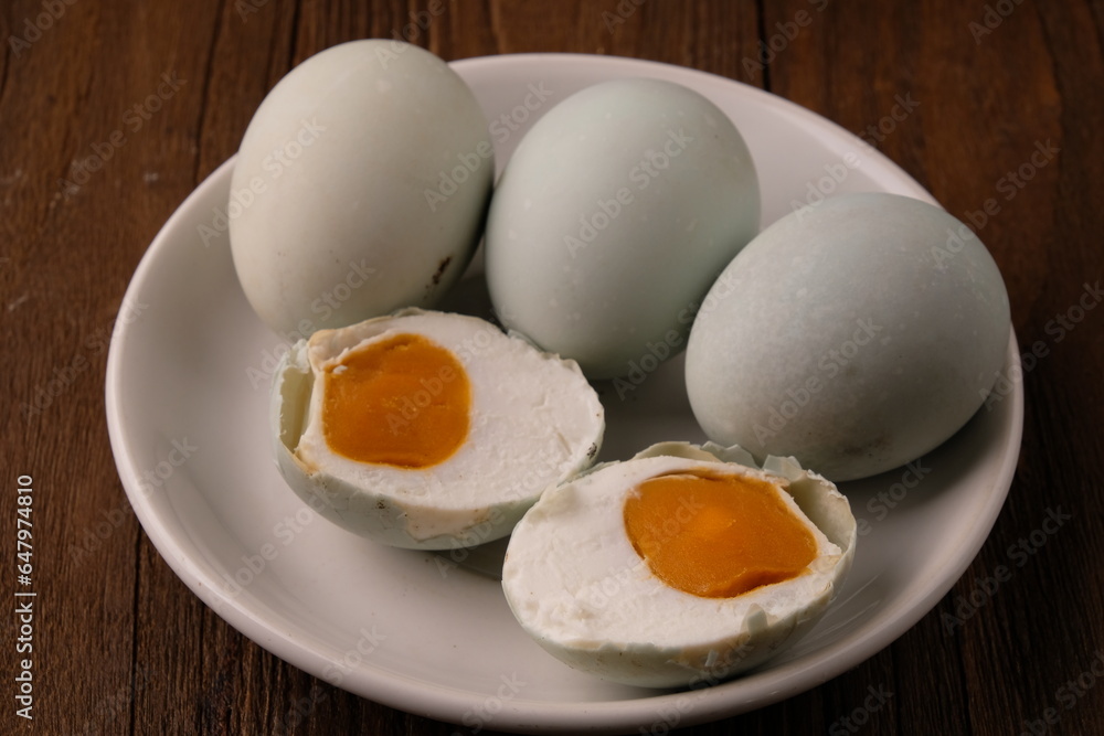 telur Asin is salted duck eggs. telur Asin are eggs made by soaking duck eggs in a salt solution. Indonesian food. telur Asin is salted duck eggs. telur Asin are eggs made by soaking duck eggs in a salt solution. Indonesian food.