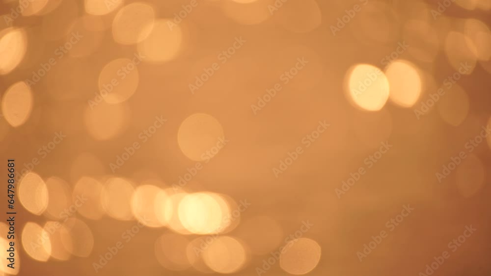 Abstract Blurred video screensaver bokeh golden sea at sunset. The sun reflects and sparkles on the waves. Abstract Blurred video screensaver bokeh golden sea at sunset. The sun reflects and sparkles on the waves.
