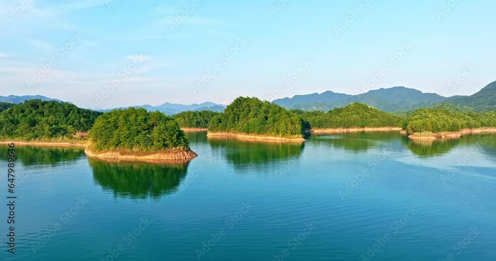 Drone ascends to photograph the island in the lake. Beautiful Qiandao Lake natural landscape in Chun'an, Hangzhou, Zhejiang Province, China. Drone ascends to photograph the island in the lake. Beautiful Qiandao Lake natural landscape in Chun'an, Hangzhou, Zhejiang Province, China.