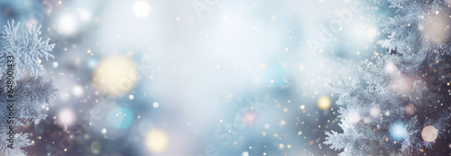 Christmas winter blurred background. Xmas tree with snow decorated with garland lights, holiday festive background. Widescreen backdrop. New year Winter art design, wide screen holiday border