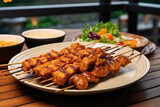 Chicken Satay On Plate In Scandinavianstyle Cafe