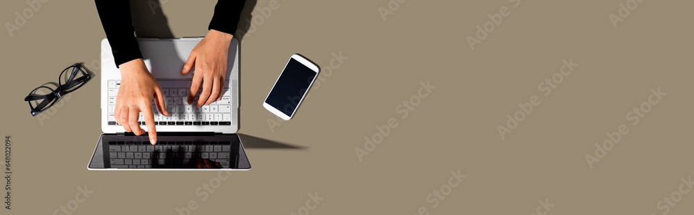 Fototapeta premium Person using a laptop computer from above