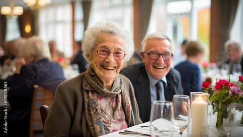 smiling elderly couple sitting at a table with glasses and flowers Generative AI