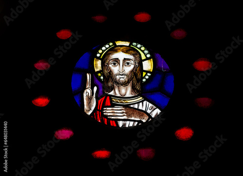 Detail of the Christ Pantocrator within the rose wheel window of the West façade of the Lisbon Saint Mary Cathedral. Taken in Portugal in Septembre 2023.