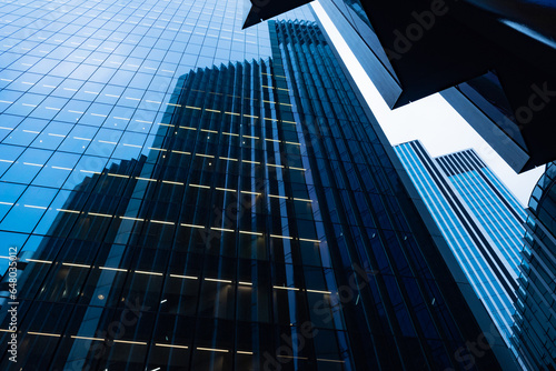 Modern abstract reflections in glass fronted commercial office buildings in the financial district of the British capital London.