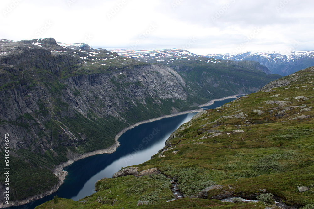 Trail to Trolltunga nature attraction. Beutifull view of fjord and mountain Wild pristine nature background.