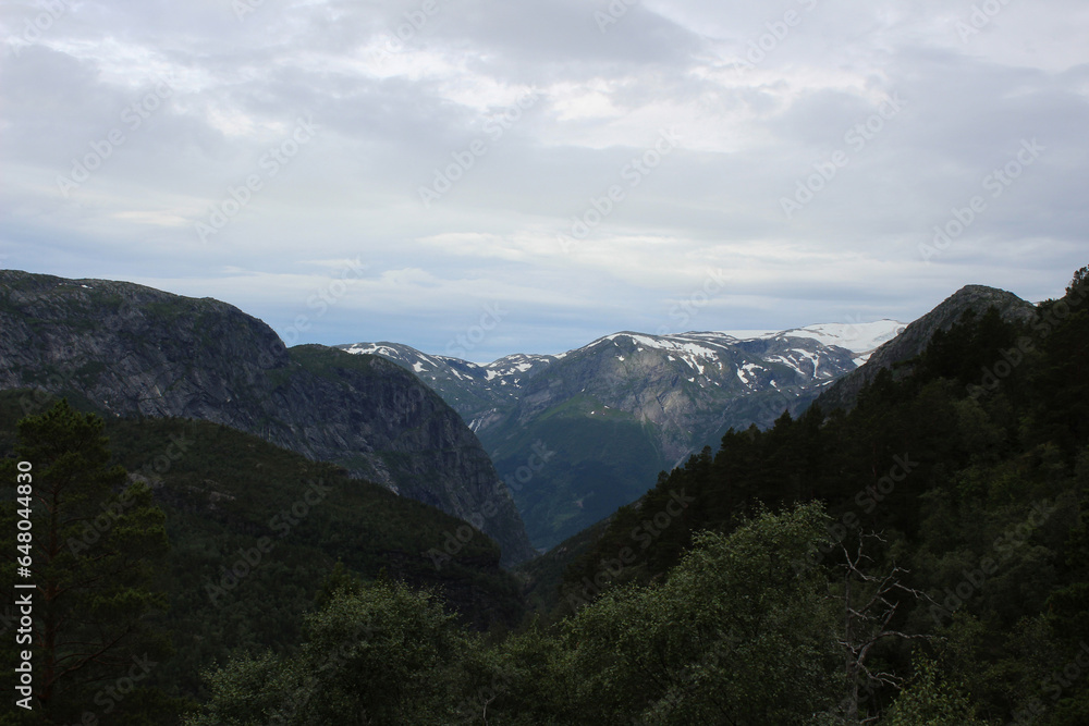 Mountain landscapes of Norway. The top of the mountain range, mountain lake. Hiking to Troltunga