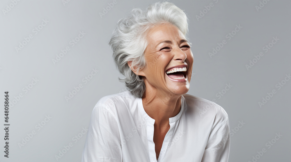 A closeup photo of a elderly senior model woman laughing and smiling with clean teeth on white background - obrazy, fototapety, plakaty 