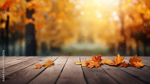 Empty plank of blurred autumn garden with beautiful natural autumn background.