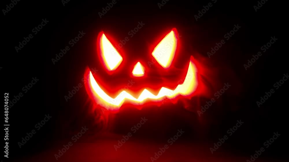 Glowing jack o lantern face on black background, smoke and haze, 4k high resolution halloween asset. Glowing jack o lantern face on black background, smoke and haze, 4k high resolution halloween asset.