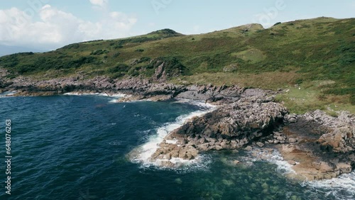 Isle of Bute, UK, July 2023, view of the cliffs and rocks on the south coast photo